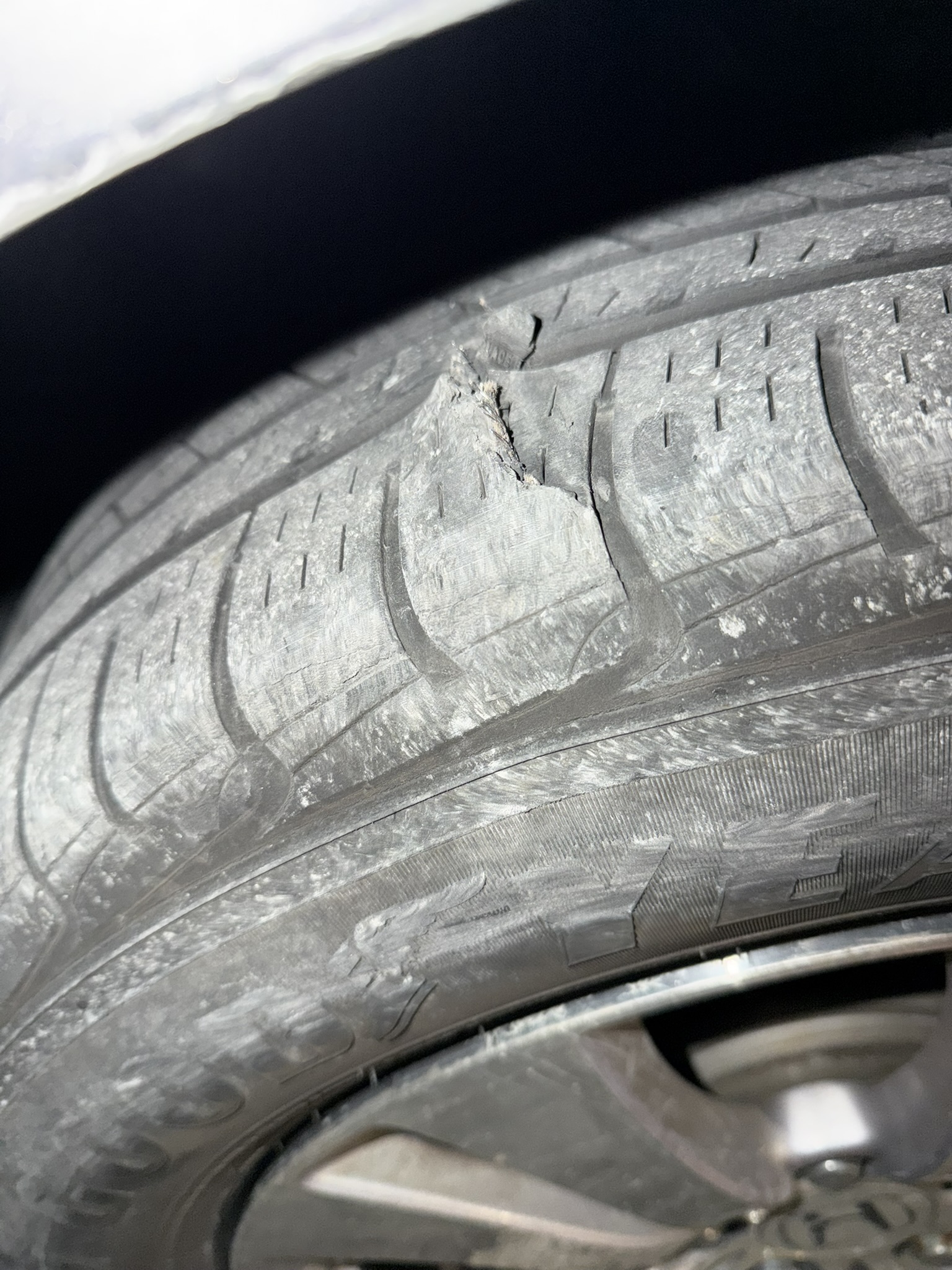 The blown tire that inspired the scissor jack design